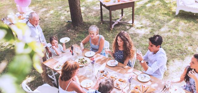 Intergenerational Family Having a Feast Outside